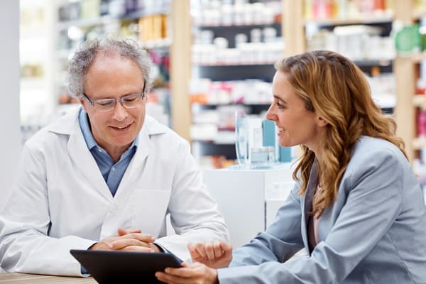 A pharmacist meets with a consultant.