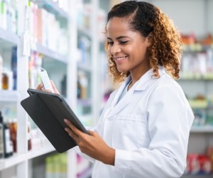 Pharmacist looking at tablet