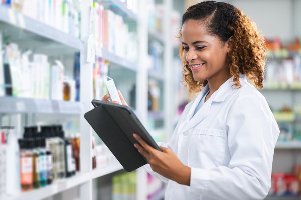 Pharmacist looking at tablet